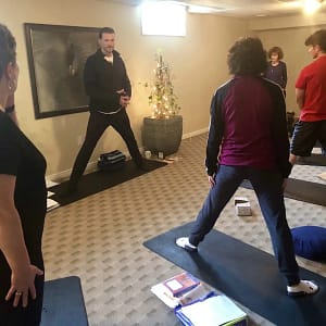 Yoga Education with Yogesh teaching a gentle yoga class