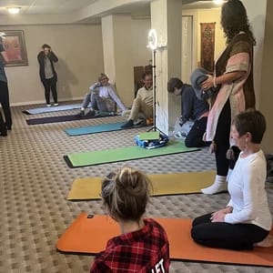 Students learning in Yoga Class