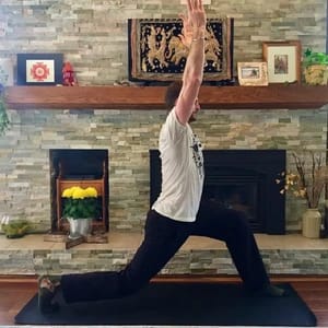 Yogesh Demonstrates Warrior 1 In A Yoga Class