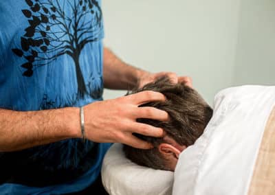 Performing an ayurvedic spa massage treatment