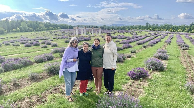 Students and instructors in a lavender field during a Ayurvedic Panchakarma retreat